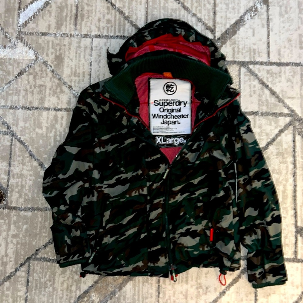 Super dry army wind breaker. Love this jacket. True to size. Multiple zippers